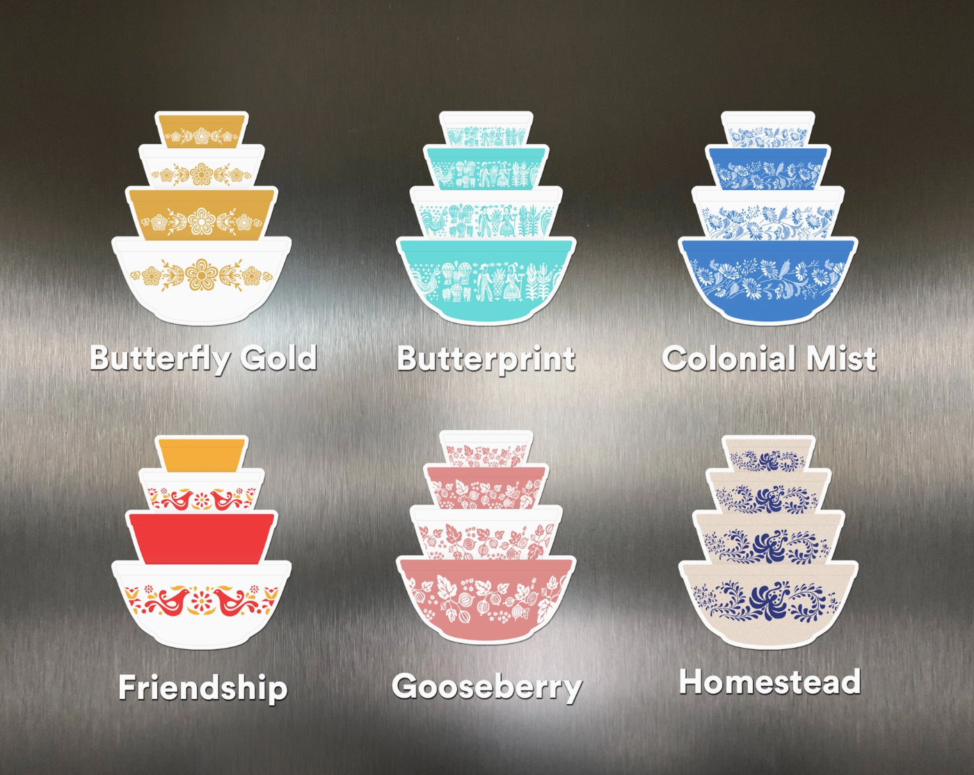 Set of six decorative bowls with different patterns on a metallic surface