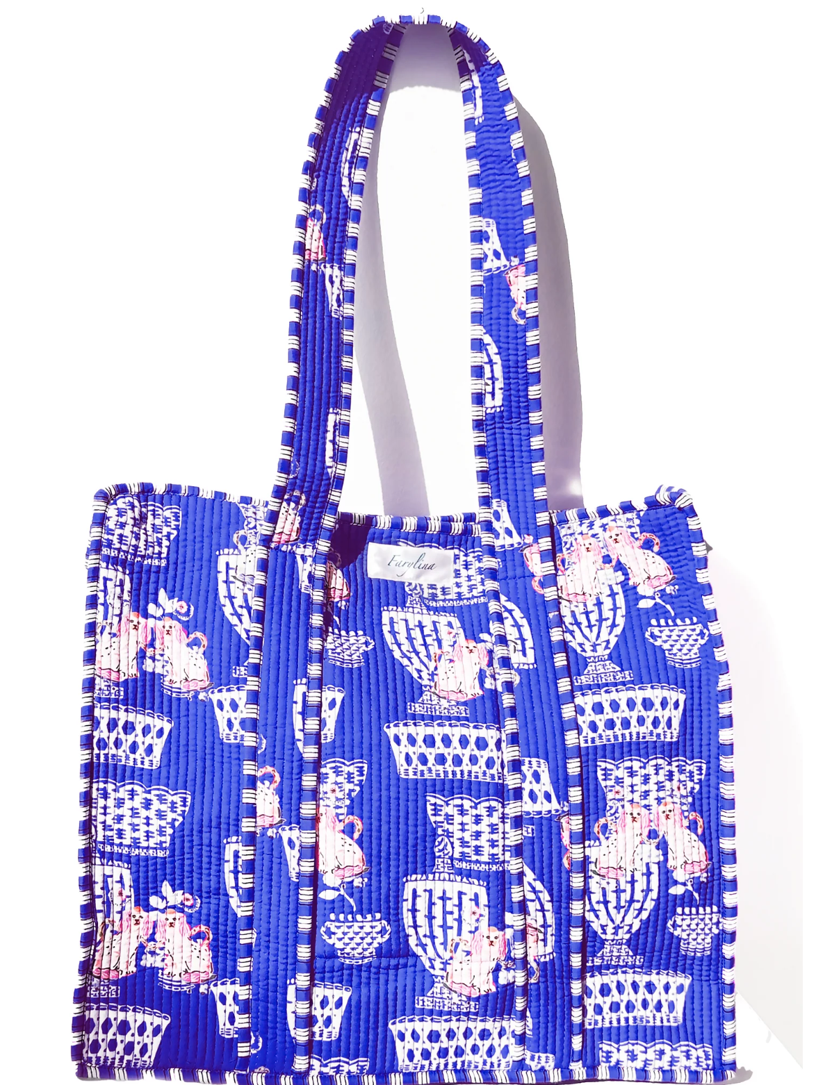Blue tote bag with white pattern on a white background