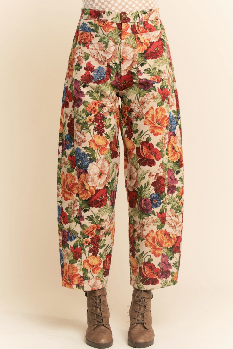 Floral patterned pants on a plain background