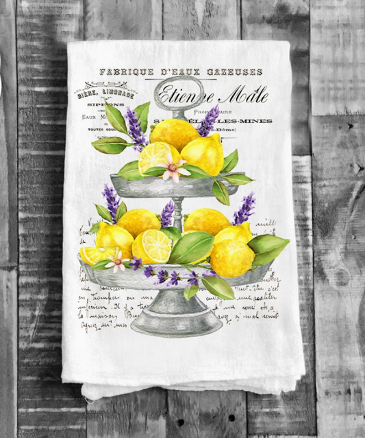 Tea towel with lemon and lavender design on a wooden background