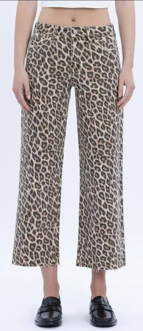 Leopard print pants worn by a person on a white background