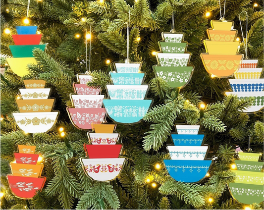 Colorful ceramic bowl ornaments hanging on a Christmas tree.