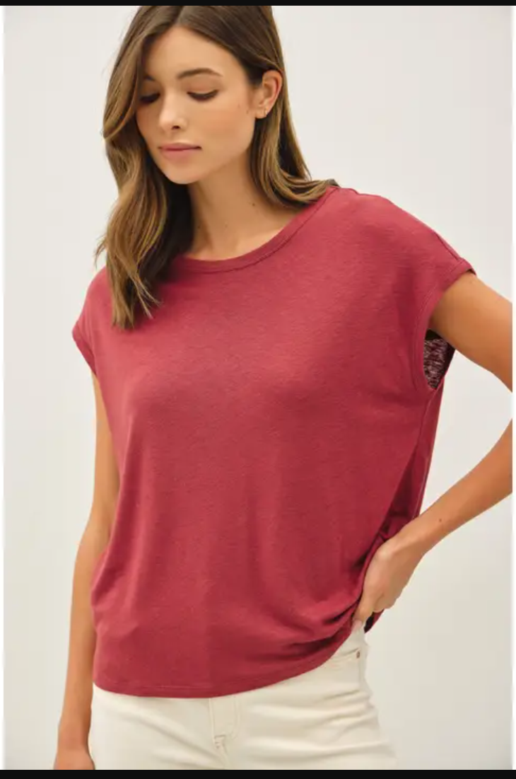 Woman wearing a red t-shirt against a white background